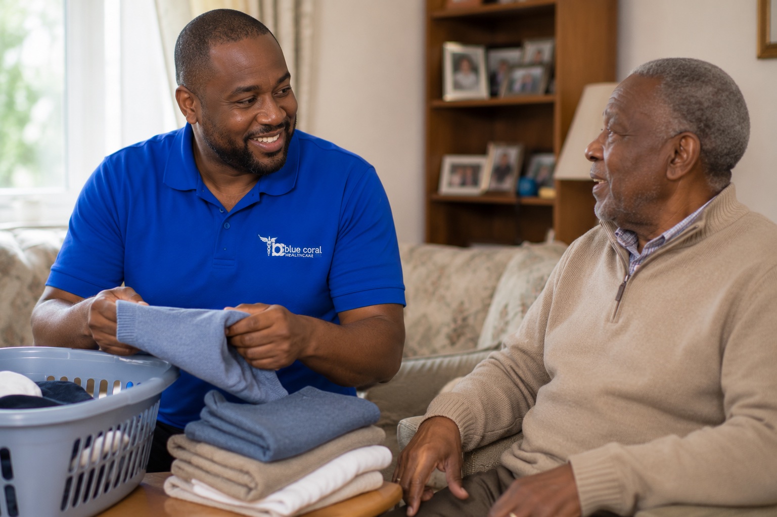 Blue Coral Healthcare carer helping with laundry and home tasks for an elderly man in Sheffield