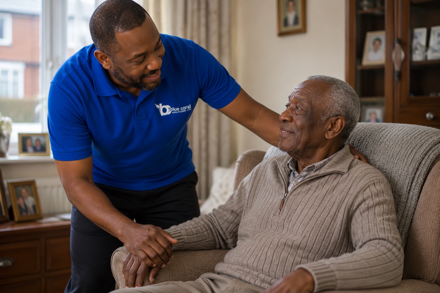 Blue Coral Healthcare live-in carer helping an elderly man settle comfortably at home in Sheffield