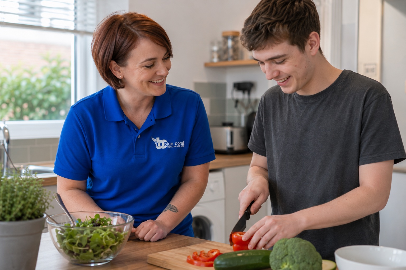 Blue Coral Healthcare support worker helping a young adult build independence skills at home in Sheffield